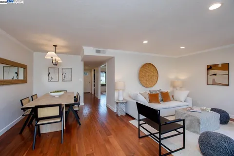 a living room with furniture a table and a fireplace