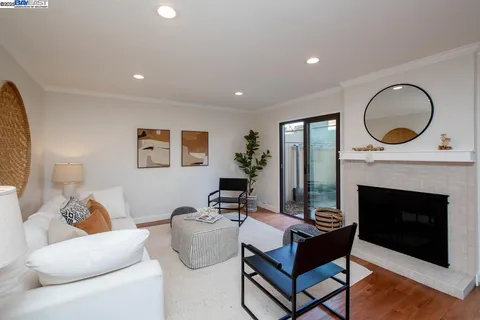 a view of a dining room with furniture wooden floor and chandelier