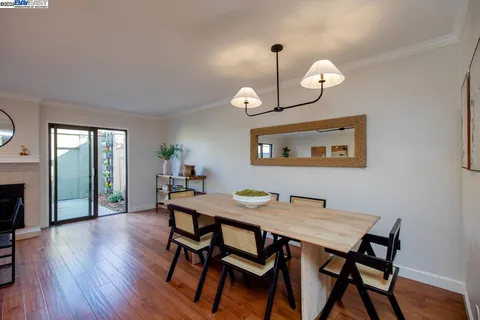 a kitchen with cabinets appliances and a window