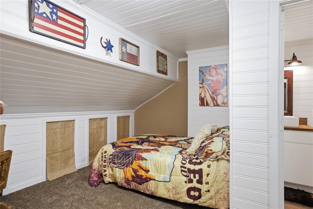 10 Ss Cooper, TX 75432 - Photo 22 of 40 a bedroom with a bed and a painting on the wall