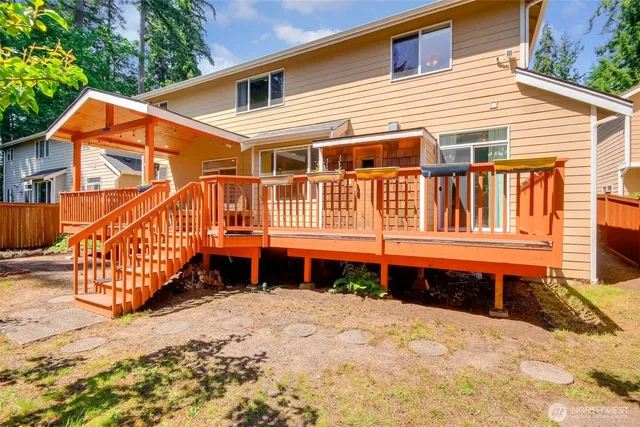 a balcony with wooden floor and outdoor space