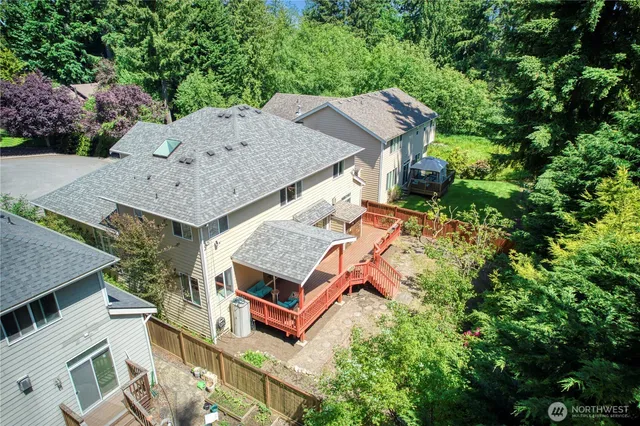 a view of a house with yard and sitting area
