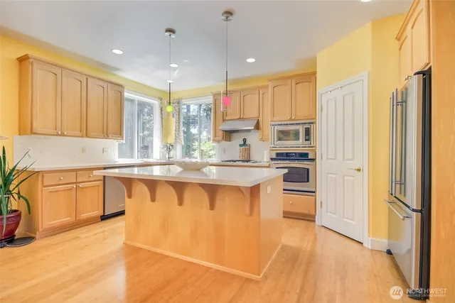 a kitchen with lots of counter top space and living room
