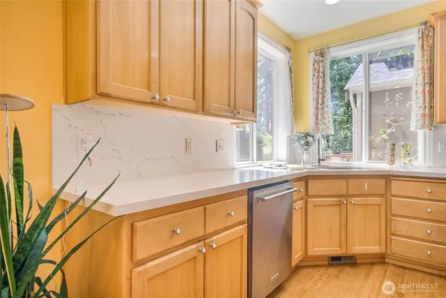 a view of kitchen with cabinets and stainless steel appliances