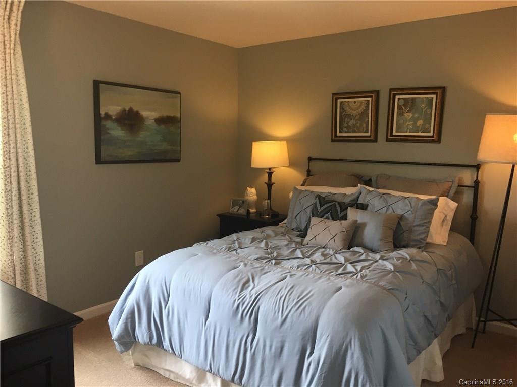 1010 Currituck Way, Unit 67 York, SC 29745 - Photo 13 of 24 a bed sitting in a bedroom next to a window