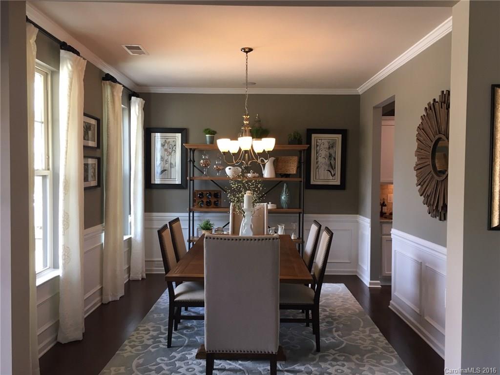 1010 Currituck Way, Unit 67 York, SC 29745 - Photo 4 of 24 a dining room with furniture a chandelier and a window