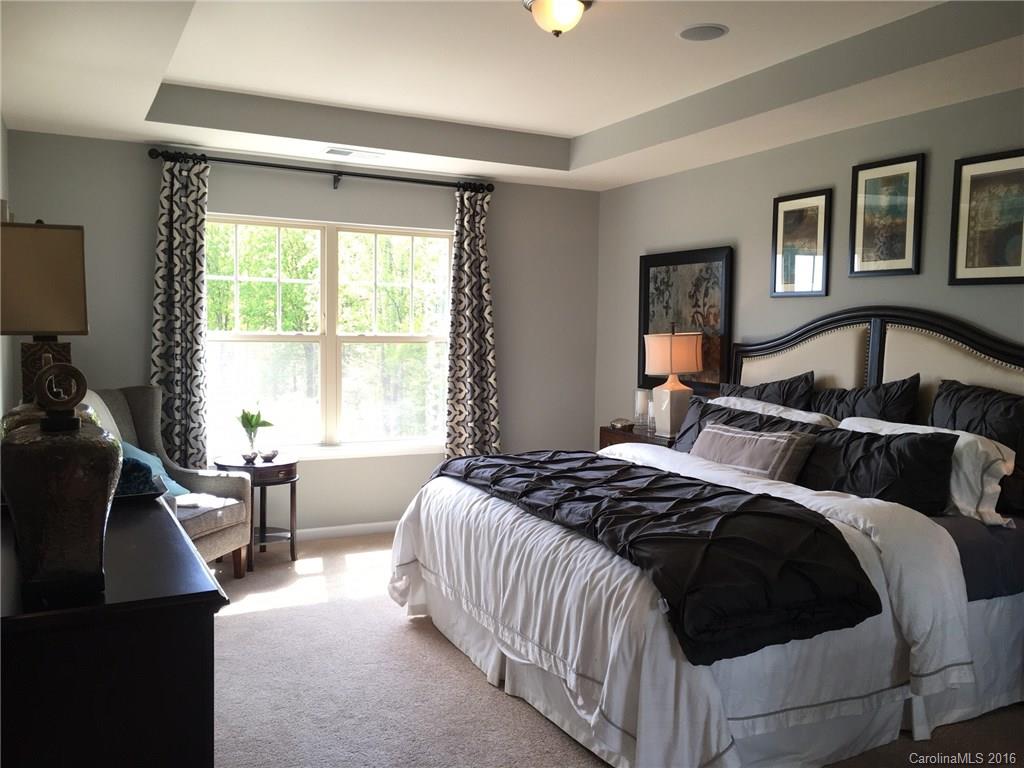 1010 Currituck Way, Unit 67 York, SC 29745 - Photo 6 of 24 a bedroom with a bed a couch and a window