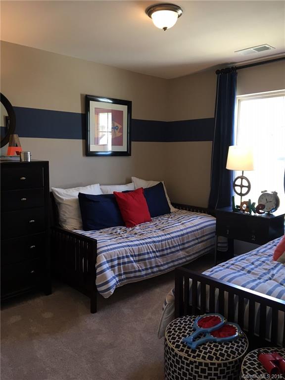 1010 Currituck Way, Unit 67 York, SC 29745 - Photo 9 of 24 a bedroom with a bed table and window