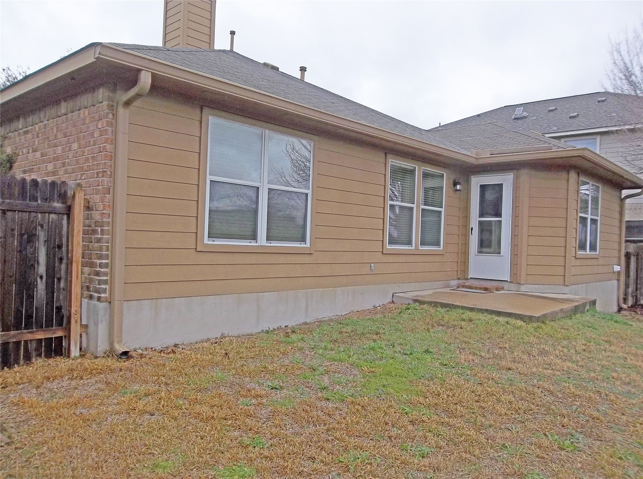 110 Fossil Trail Leander, TX 78641 - Photo 18 of 21 a front view of a house with a yard