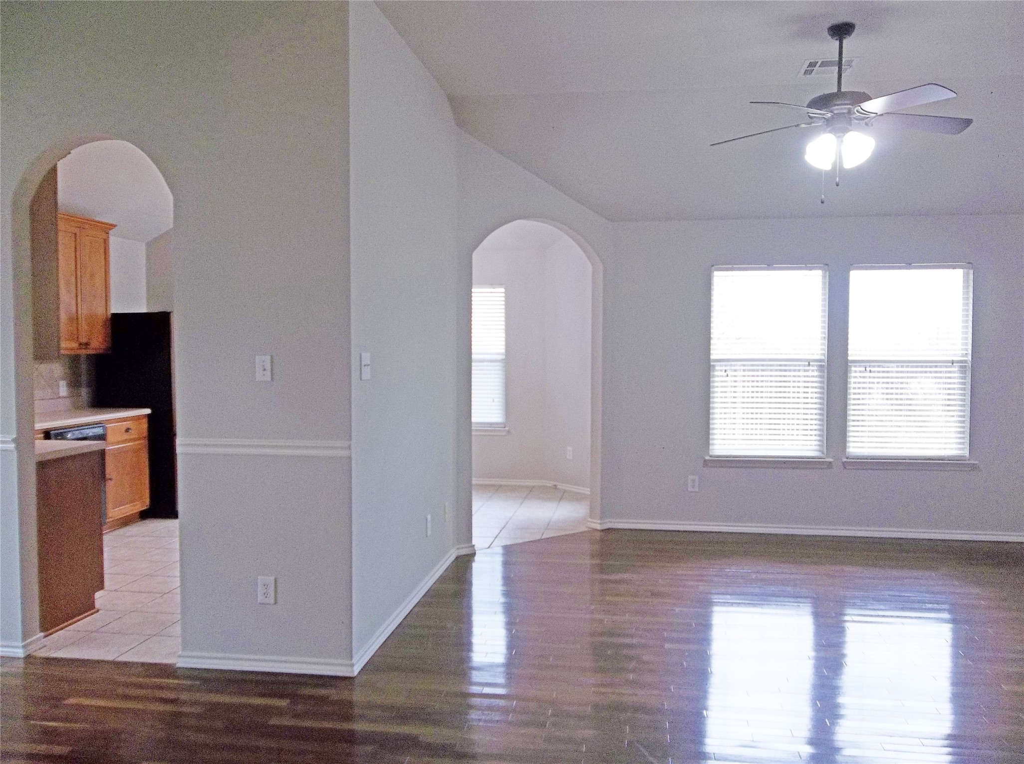 110 Fossil Trail Leander, TX 78641 - Photo 5 of 21 wooden floor in an empty room with a window