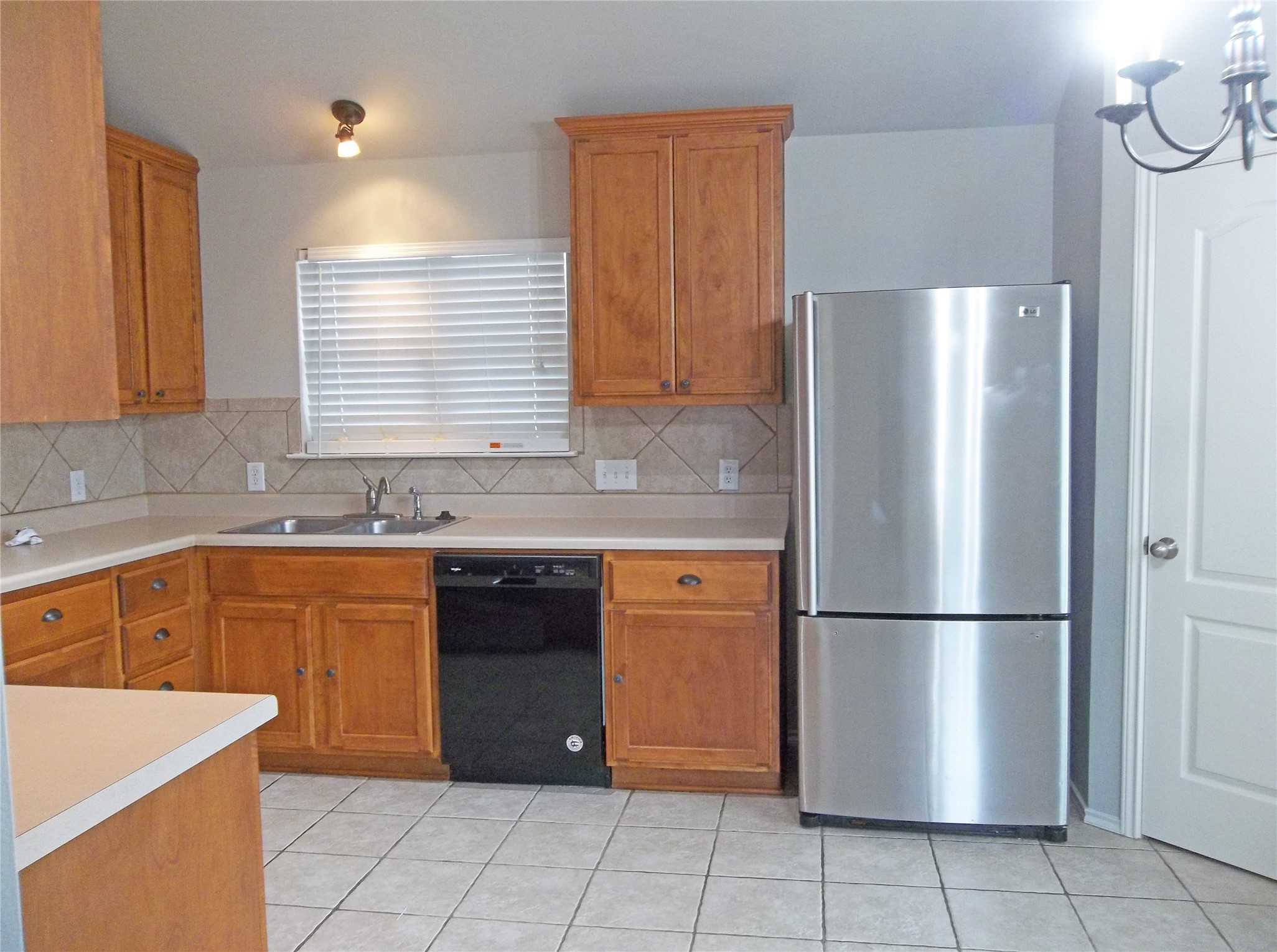 110 Fossil Trail Leander, TX 78641 - Photo 7 of 21 a kitchen with stainless steel appliances granite countertop a refrigerator and a sink