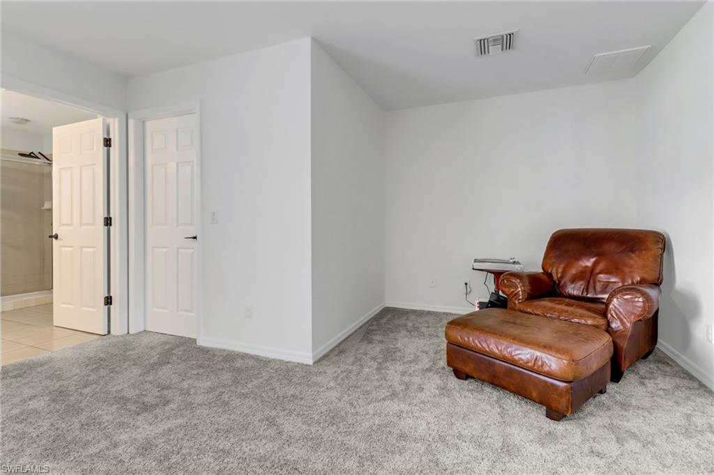 20024 Heatherstone Way, Unit 2 Estero, FL 33928 - Photo 16 of 38 a living room with furniture