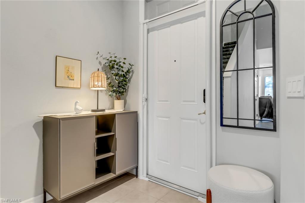 20024 Heatherstone Way, Unit 2 Estero, FL 33928 - Photo 2 of 38 a bathroom with a sink and a mirror