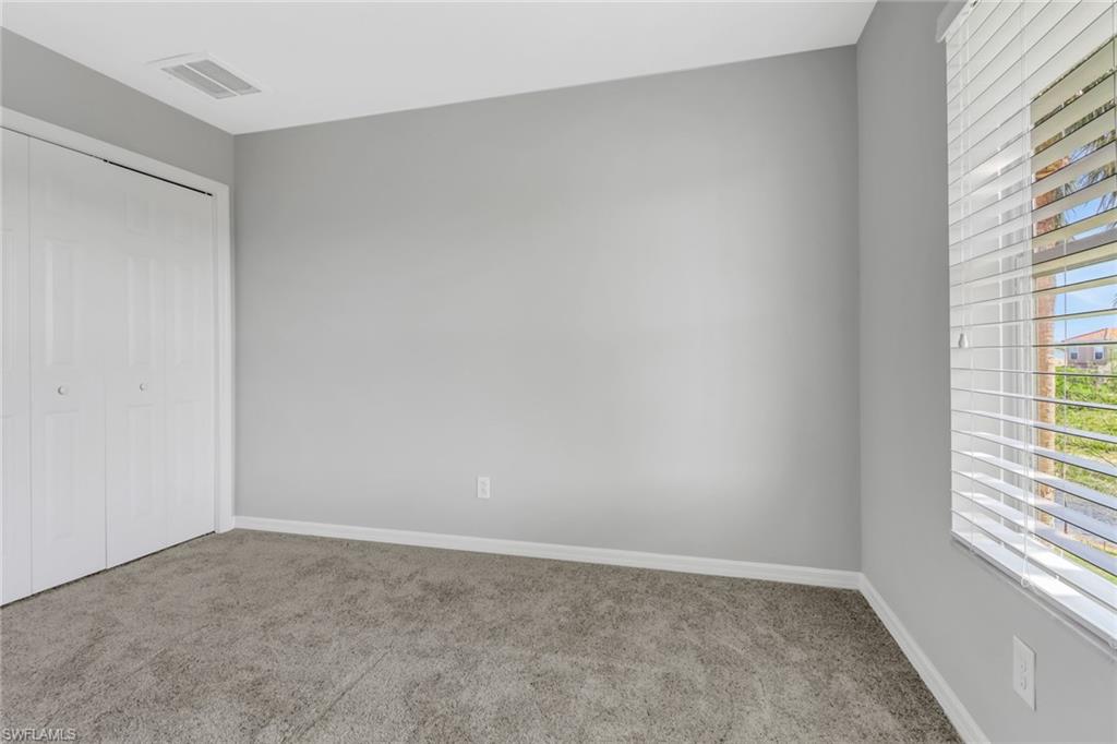 20024 Heatherstone Way, Unit 2 Estero, FL 33928 - Photo 23 of 38 a view of an empty room and a window