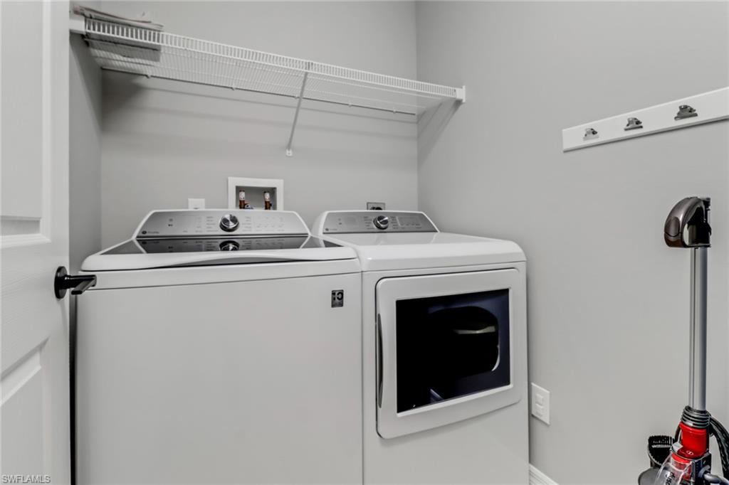 20024 Heatherstone Way, Unit 2 Estero, FL 33928 - Photo 24 of 38 a utility room with dryer and washer