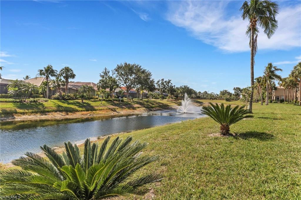 20024 Heatherstone Way, Unit 2 Estero, FL 33928 - Photo 26 of 38 a view of a lake with a beach
