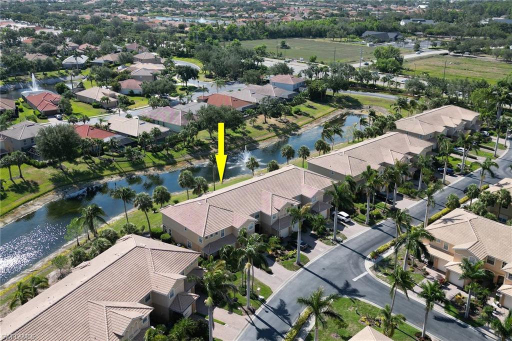 20024 Heatherstone Way, Unit 2 Estero, FL 33928 - Photo 29 of 38 an aerial view of a house with a lake view