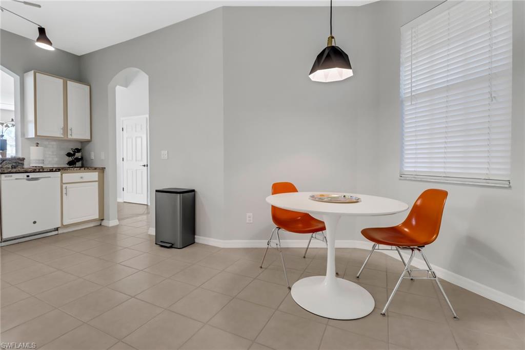 20024 Heatherstone Way, Unit 2 Estero, FL 33928 - Photo 3 of 38 a dining room with furniture and window