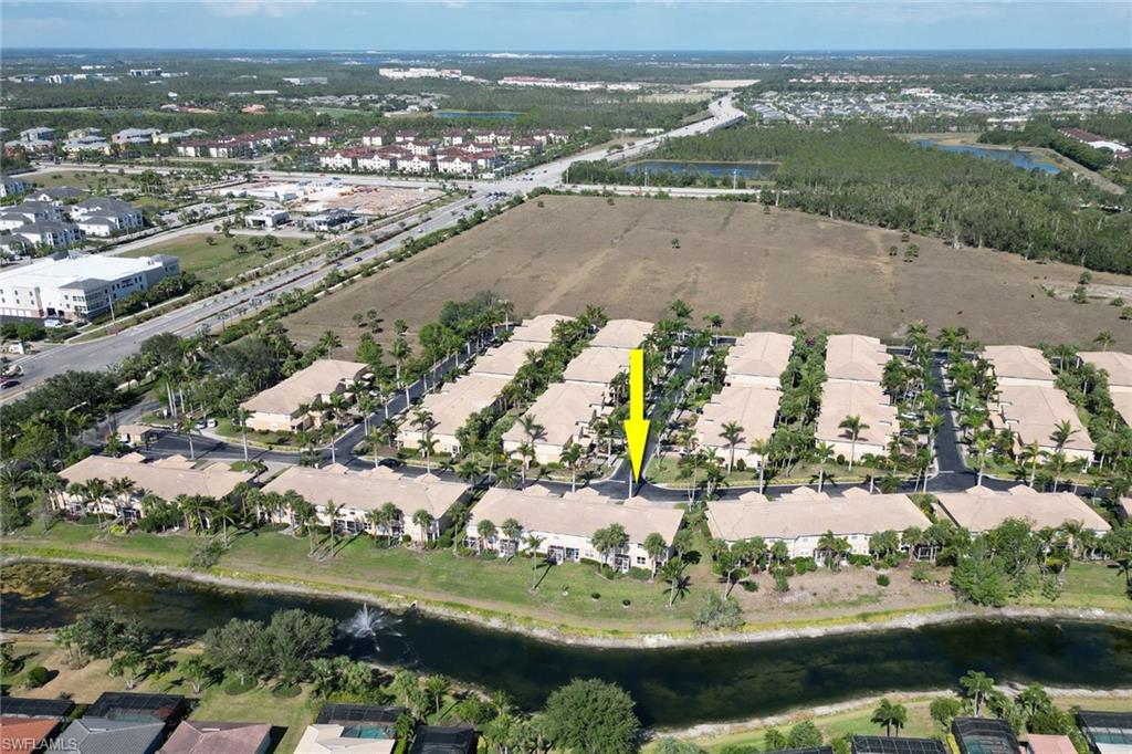 20024 Heatherstone Way, Unit 2 Estero, FL 33928 - Photo 32 of 38 an aerial view of residential houses with outdoor space