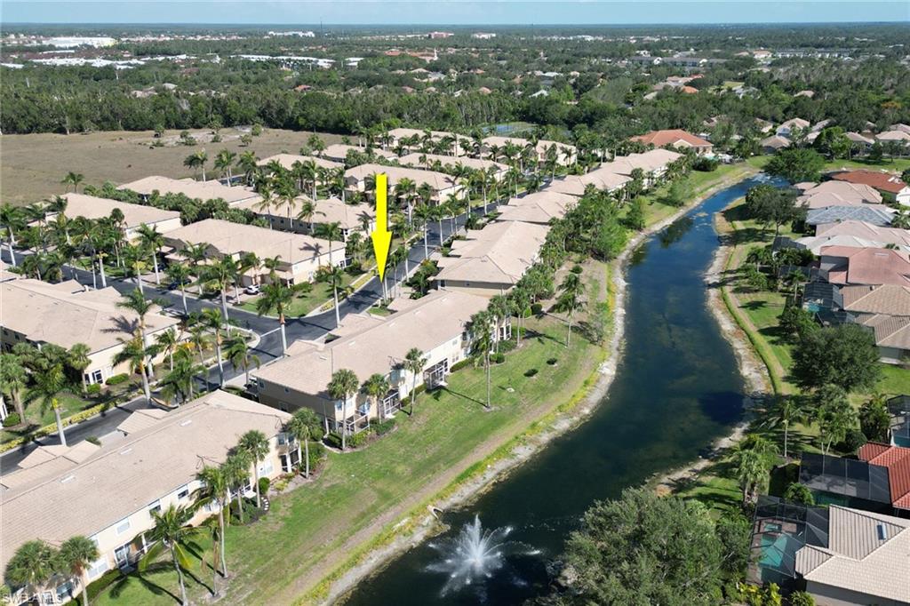 20024 Heatherstone Way, Unit 2 Estero, FL 33928 - Photo 33 of 38 an aerial view of a city with lots of residential buildings