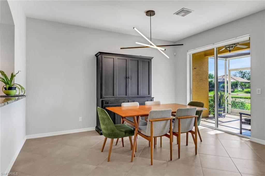 20024 Heatherstone Way, Unit 2 Estero, FL 33928 - Photo 7 of 38 a dining room with furniture and window