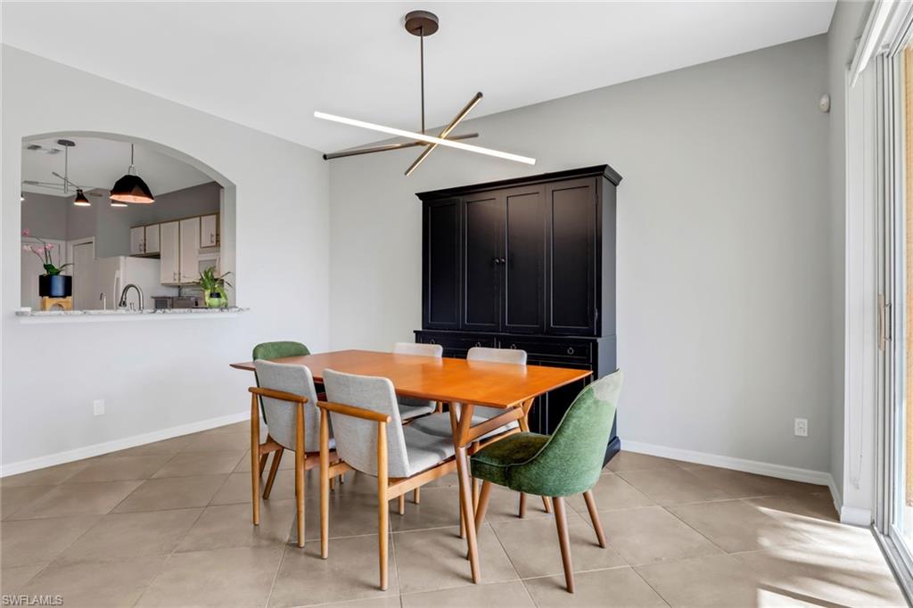 20024 Heatherstone Way, Unit 2 Estero, FL 33928 - Photo 8 of 38 a dining room with furniture and a window