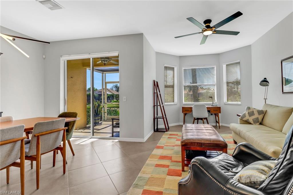 20024 Heatherstone Way, Unit 2 Estero, FL 33928 - Photo 10 of 38 a living room with furniture and a large window