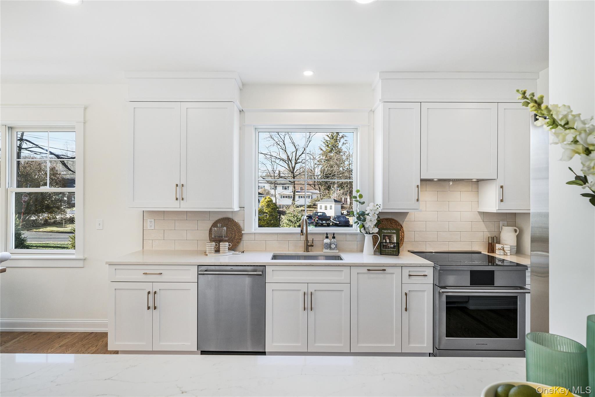 2040 Crompond Road, Unit 23 Yorktown Heights, NY 10598 - Photo 6 of 22 a kitchen with white cabinets and white appliances