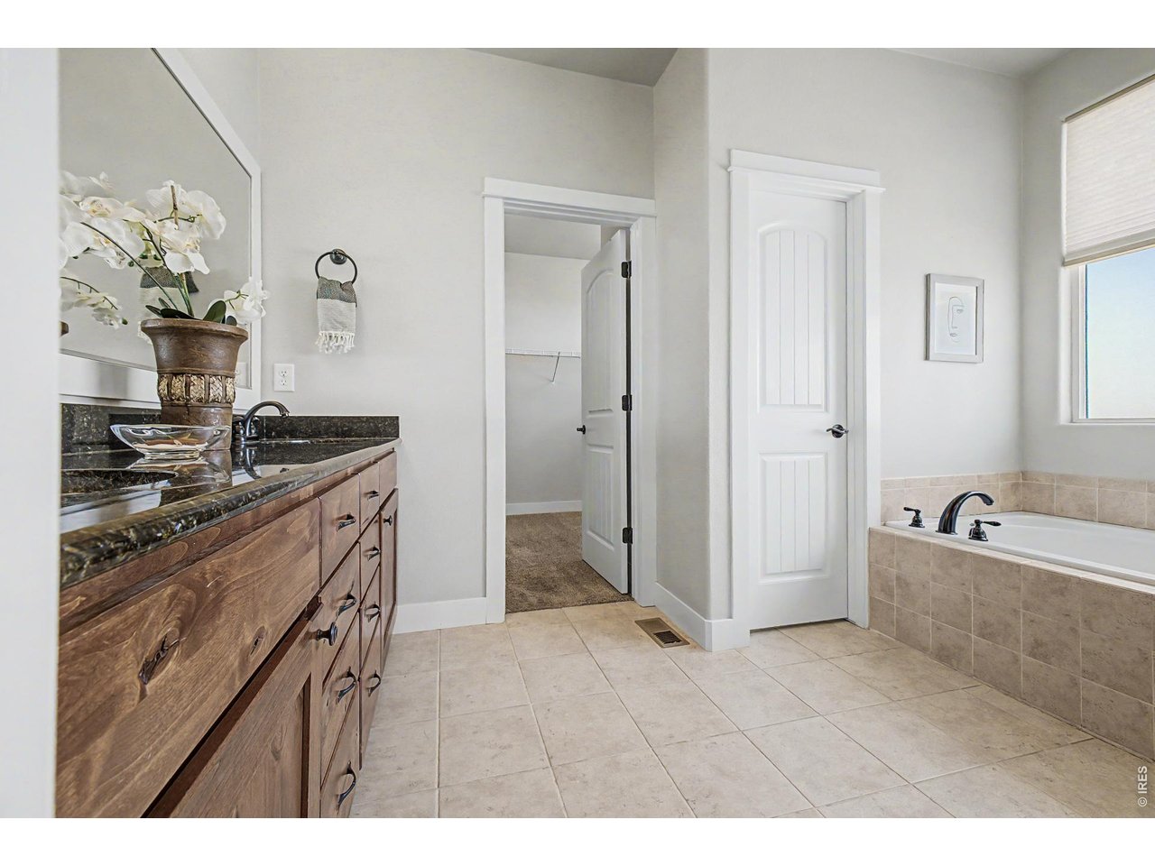 2069 Day Spring Drive Windsor, CO 80550 - Photo 15 of 47 Private five piece primary bath with dual sinks soaking tub and separate shower