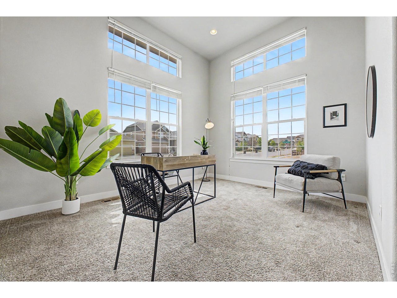 2069 Day Spring Drive Windsor, CO 80550 - Photo 29 of 47 Floor to Ceiling windows engulf the Flexible main floor space for a home office, playroom or formal dining area