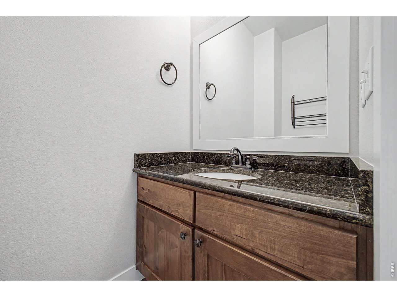 2069 Day Spring Drive Windsor, CO 80550 - Photo 30 of 47 Main floor half bathroom ideally located through the mudroom away from primary living and hosting space.