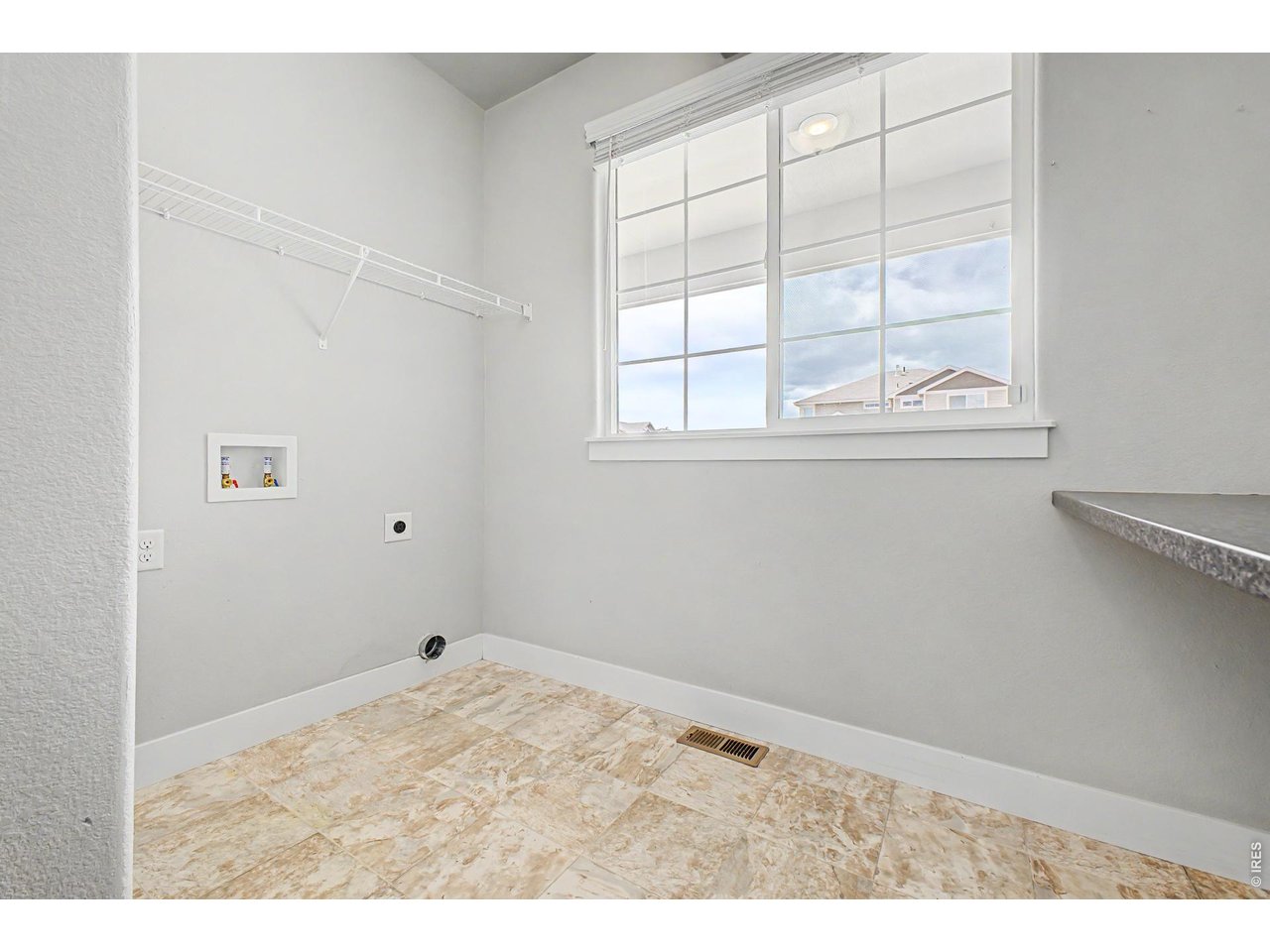 2069 Day Spring Drive Windsor, CO 80550 - Photo 32 of 47 Oversized laundry room designed for organization and convenience