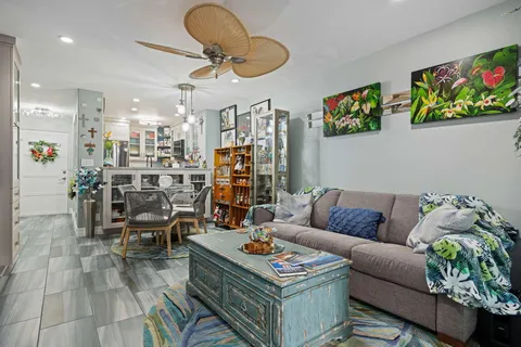 a dining room with furniture and a book shelf