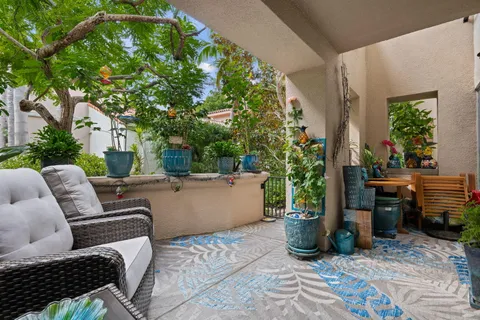 a view of backyard of house with outdoor seating