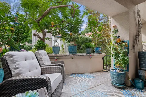 a outdoor living space with furniture and a potted plant