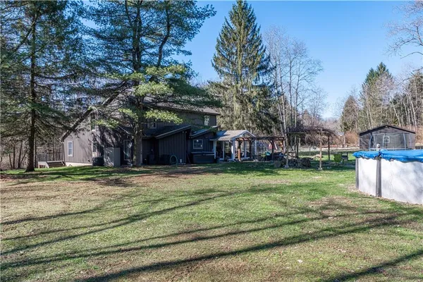 a view of a house with a yard