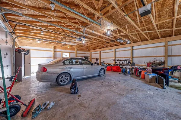 a view of a garage with parked cars