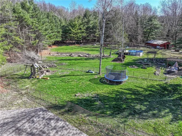 a view of a park with large trees