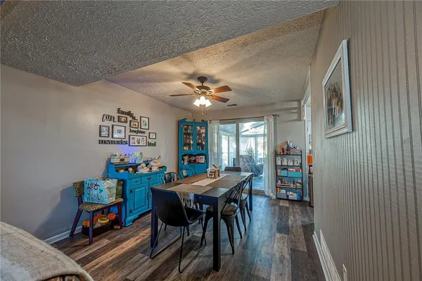 a view of a dining room with furniture and wooden floor