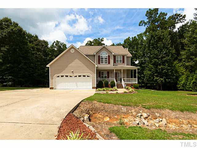 8424 Ridgebury Road Raleigh, NC 27603 - Photo 1 of 25 a front view of a house with garden
