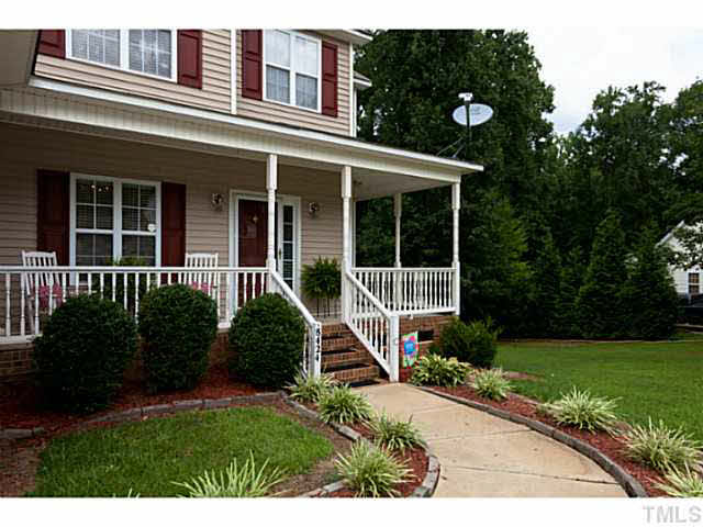 8424 Ridgebury Road Raleigh, NC 27603 - Photo 2 of 25 front view of a house with a yard