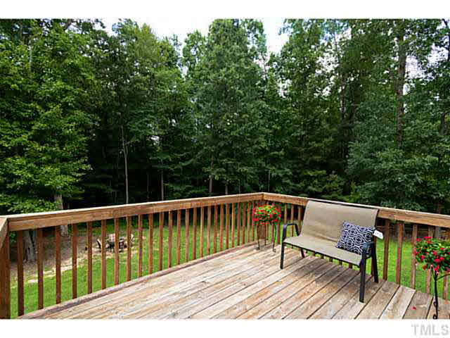 8424 Ridgebury Road Raleigh, NC 27603 - Photo 23 of 25 a view of balcony with deck and outdoor seating