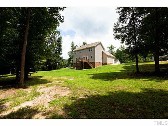 8424 Ridgebury Road Raleigh, NC 27603 - Photo 24 of 25 a view of a house with yard and tree s