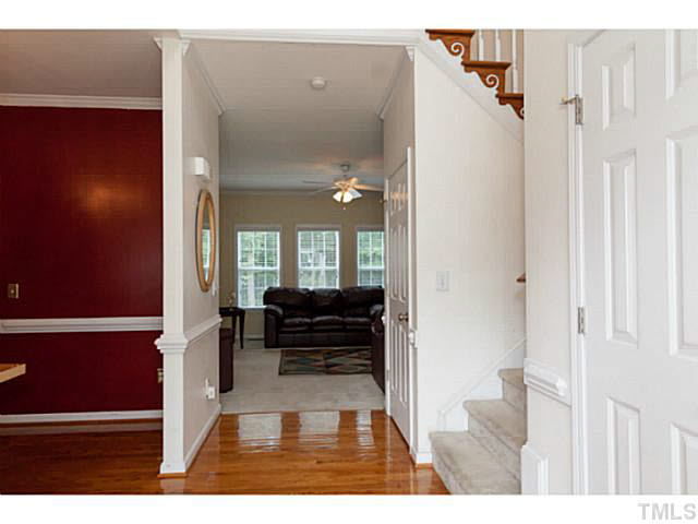 8424 Ridgebury Road Raleigh, NC 27603 - Photo 4 of 25 a view of living room with furniture and wooden floor