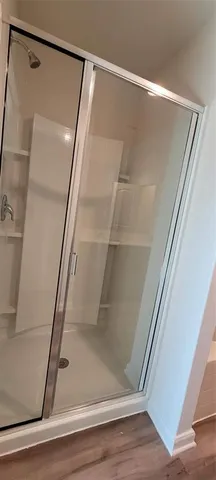 a view of bathroom with wooden floor and staircase