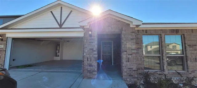 a view of hallway with chandelier