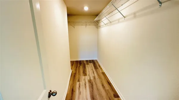 a bathroom with a double vanity sink and mirror
