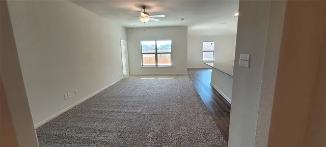 wooden floor in a hall with a window