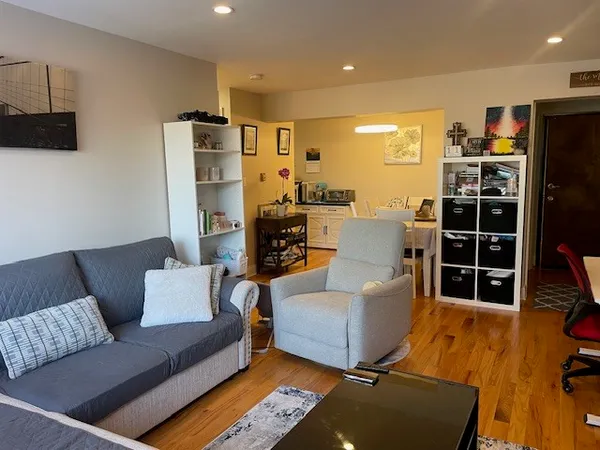 a living room with furniture window and a flat screen tv