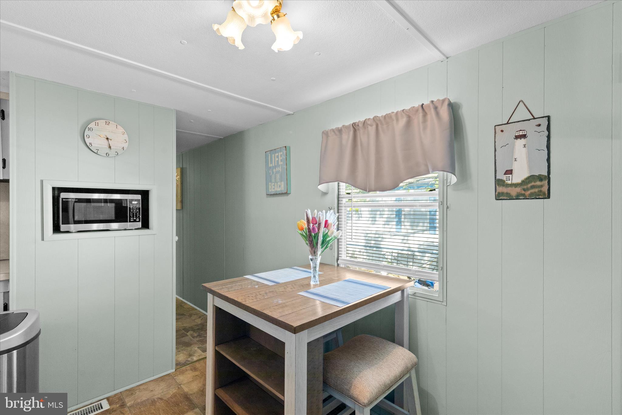 38215 Possum Road Ocean View, DE 19970 - Photo 8 of 26 a room with a table and chairs